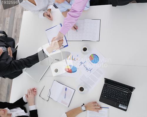 Image of Group of young business people at meeting