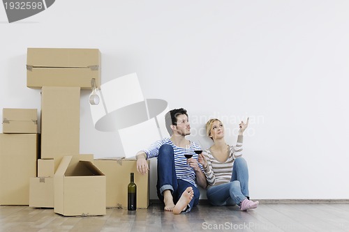 Image of Young couple moving in new home