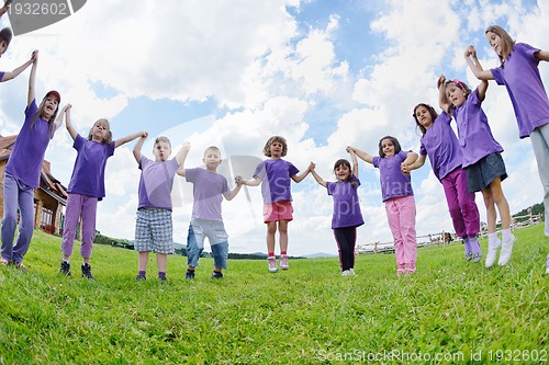 Image of happy kids group  have fun in nature