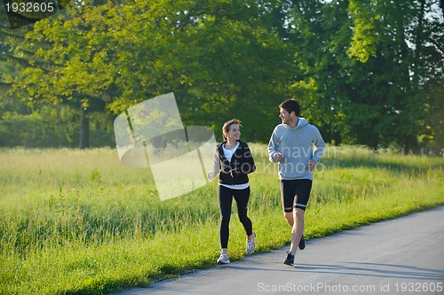 Image of Young couple jogging