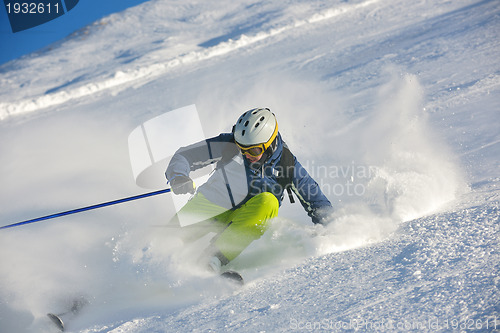 Image of skiing on fresh snow at winter season at beautiful sunny day