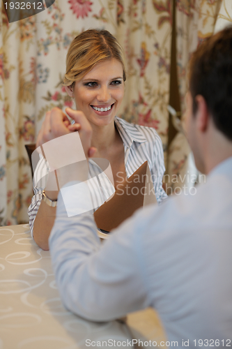 Image of young couple having dinner at a restaurant