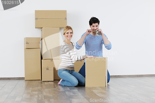 Image of Young couple moving in new house