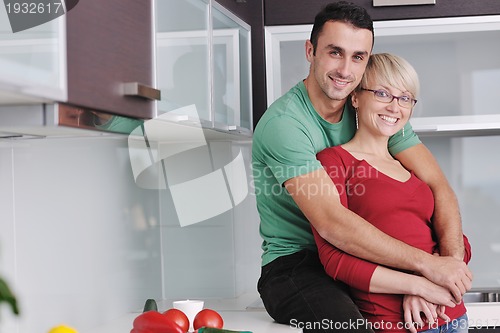 Image of young couple have fun in modern kitchen