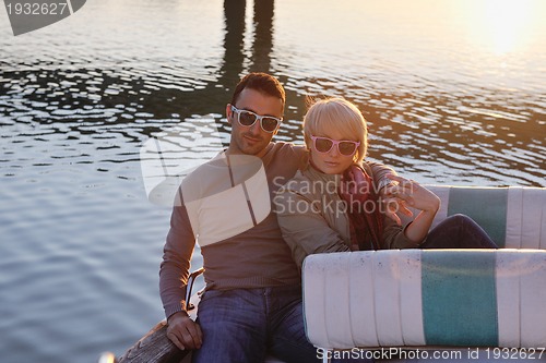 Image of couple in love  have romantic time on boat