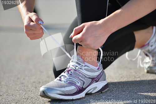 Image of Young beautiful  woman jogging at morning in park