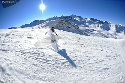 Image of skiing on fresh snow at winter season at beautiful sunny day