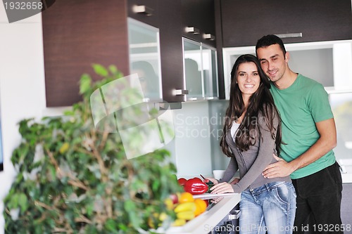 Image of young couple have fun in modern kitchen
