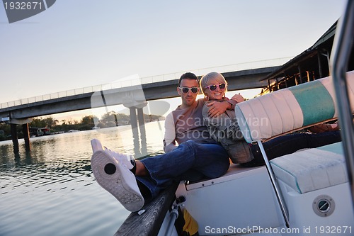 Image of couple in love  have romantic time on boat