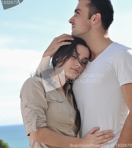 Image of couple relaxing on balcony