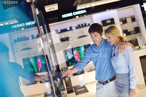 Image of people buy  in consumer electronics store