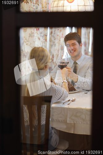 Image of young couple having dinner at a restaurant