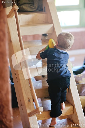 Image of beautiful young child making first steps