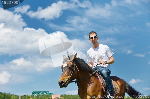 Image of man ride horse