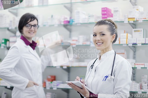 Image of team of pharmacist chemist woman  in pharmacy drugstore