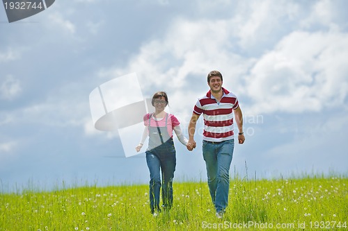 Image of romantic young couple in love together outdoor