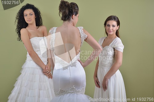 Image of portrait of a three beautiful woman in wedding dress