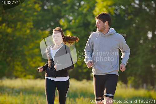 Image of Young couple jogging