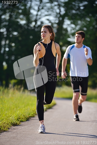 Image of Young couple jogging