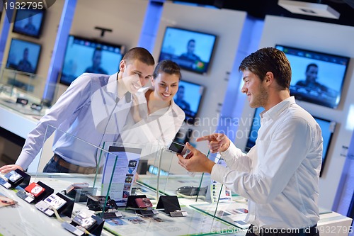 Image of people buy  in consumer electronics store