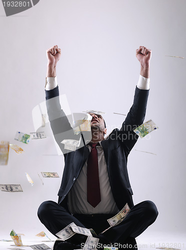 Image of Business man holding money