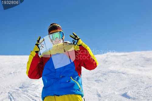 Image of skiing on fresh snow at winter season at beautiful sunny day