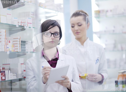 Image of team of pharmacist chemist woman  in pharmacy drugstore