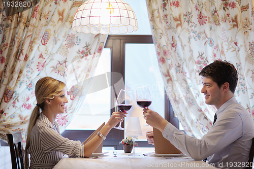 Image of young couple having dinner at a restaurant