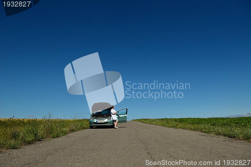 Image of woman with broken car