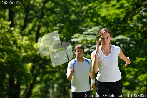 Image of Young couple jogging