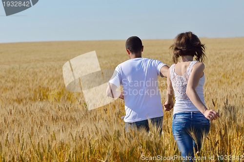 Image of happy couple in wheat field