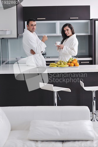 Image of young couple have fun in modern kitchen