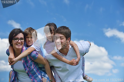 Image of happy young family have fun outdoors