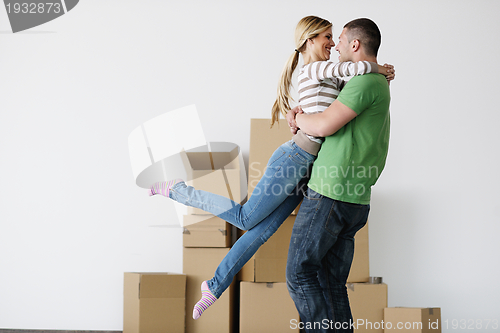 Image of Young couple moving in new house