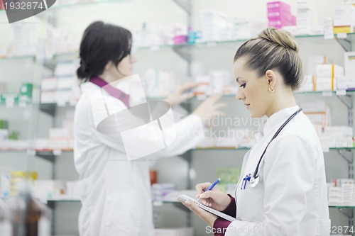 Image of team of pharmacist chemist woman  in pharmacy drugstore