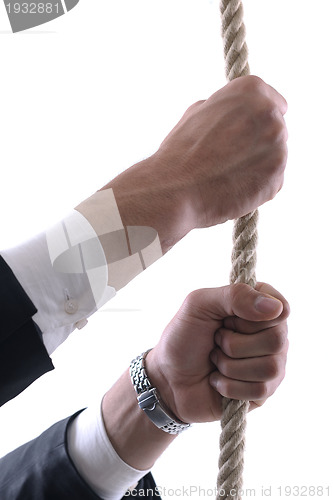 Image of business man with rope isolated on white background