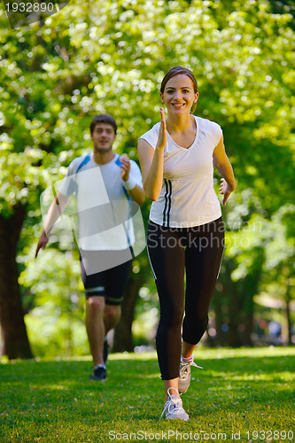 Image of Young couple jogging