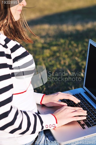 Image of young teen girl work on laptop outdoor