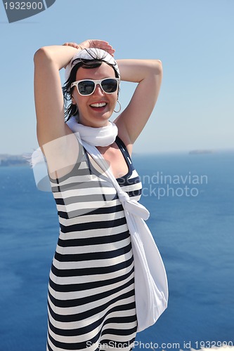 Image of Greek woman on the streets of Oia, Santorini, Greece