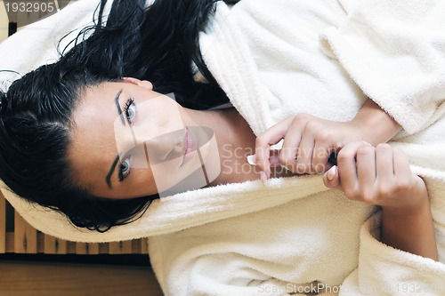 Image of Young woman take a steam bath