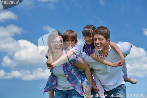 Image of happy young family have fun outdoors
