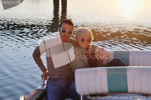 Image of couple in love  have romantic time on boat