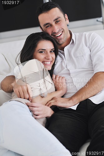 Image of happy young couple relax at home