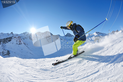 Image of skiing on fresh snow at winter season at beautiful sunny day