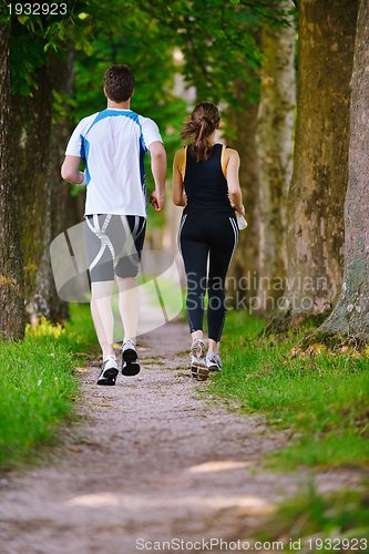 Image of Young couple jogging