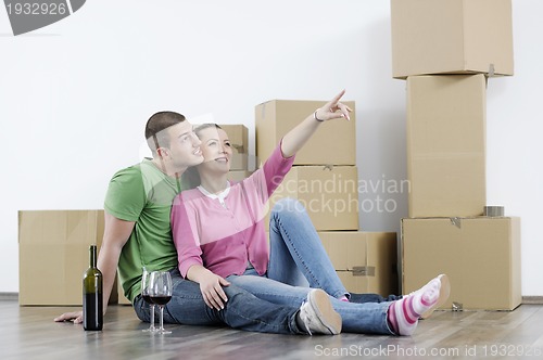 Image of Young couple moving in new home