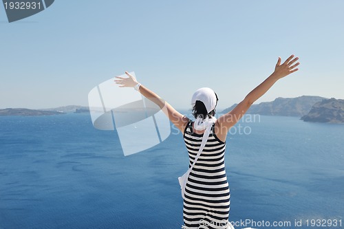 Image of Greek woman on the streets of Oia, Santorini, Greece