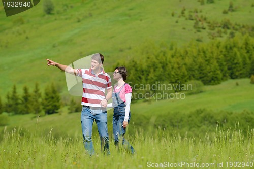 Image of romantic young couple in love together outdoor