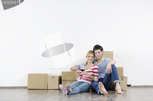 Image of Young couple moving in new home