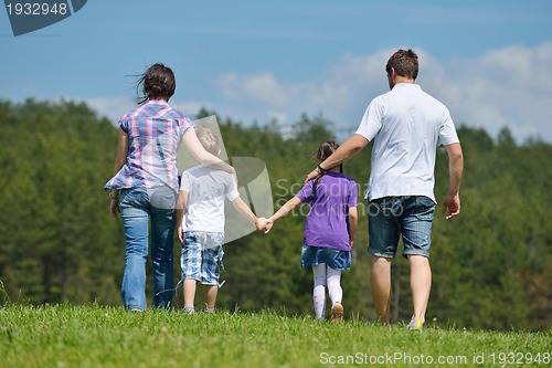 Image of happy young family have fun outdoors
